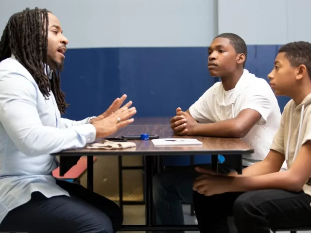 man mentoring youth